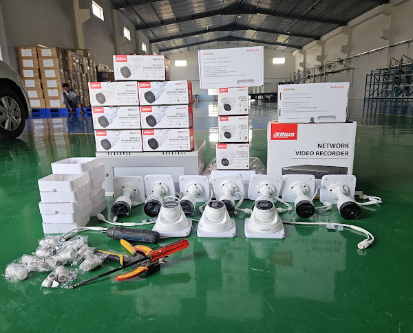 Cameras, recorders and installation tools laid out on site.